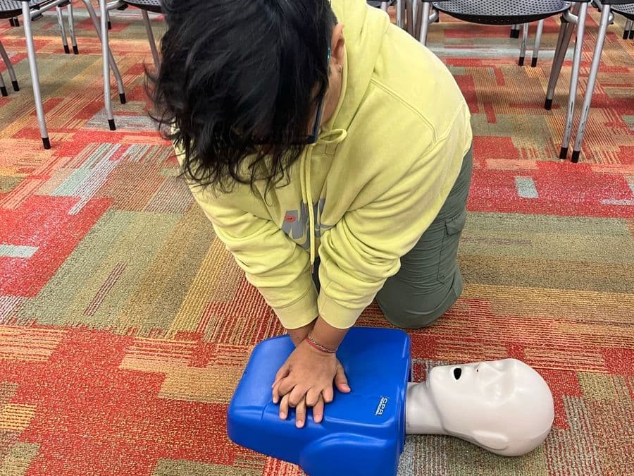 A workplace CPR training session in progress