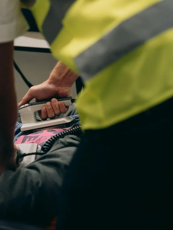 An emergency medical team working a patient during advanced resuscitation